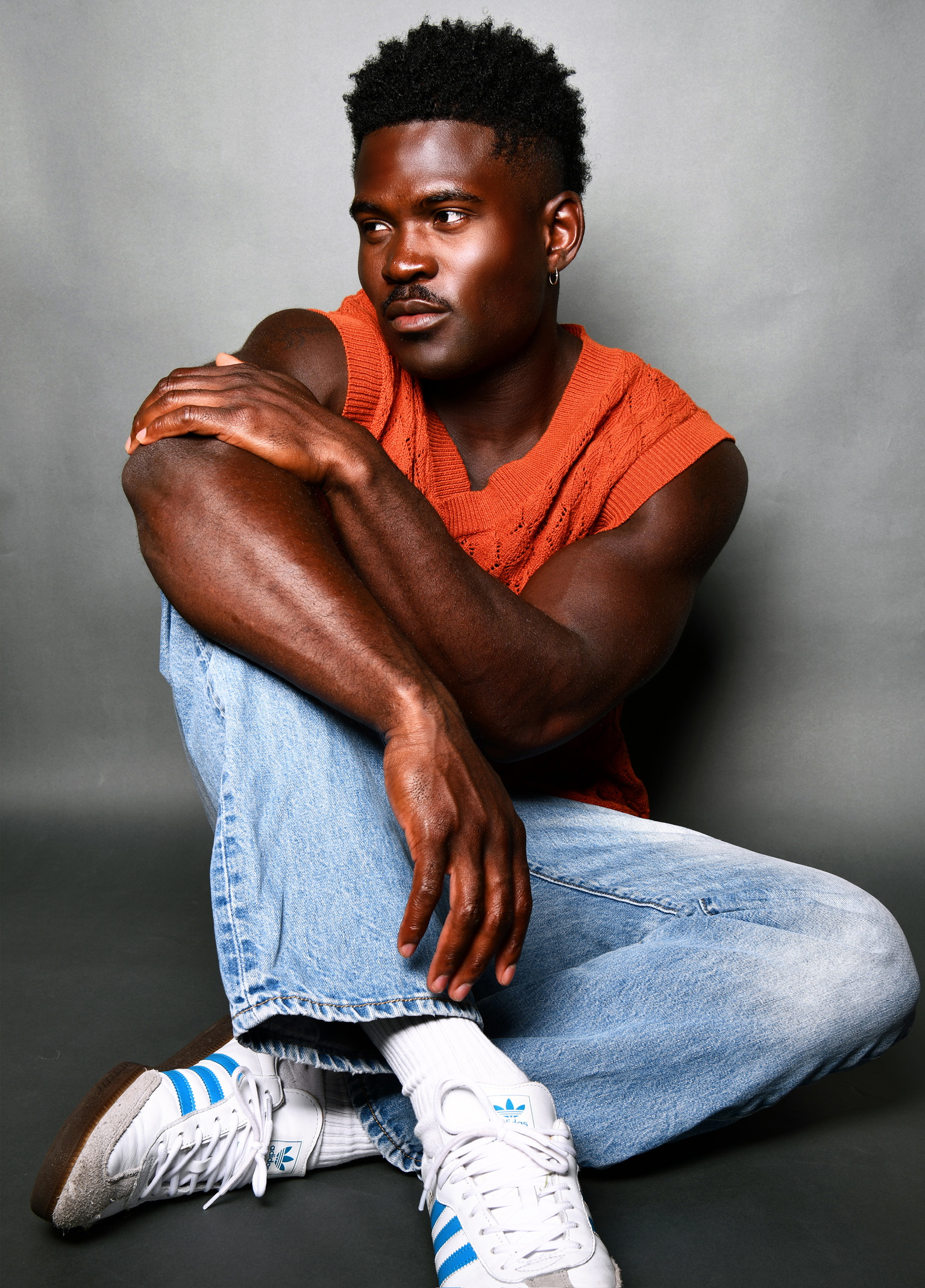 Joseph Foley — orange knit vest editorial