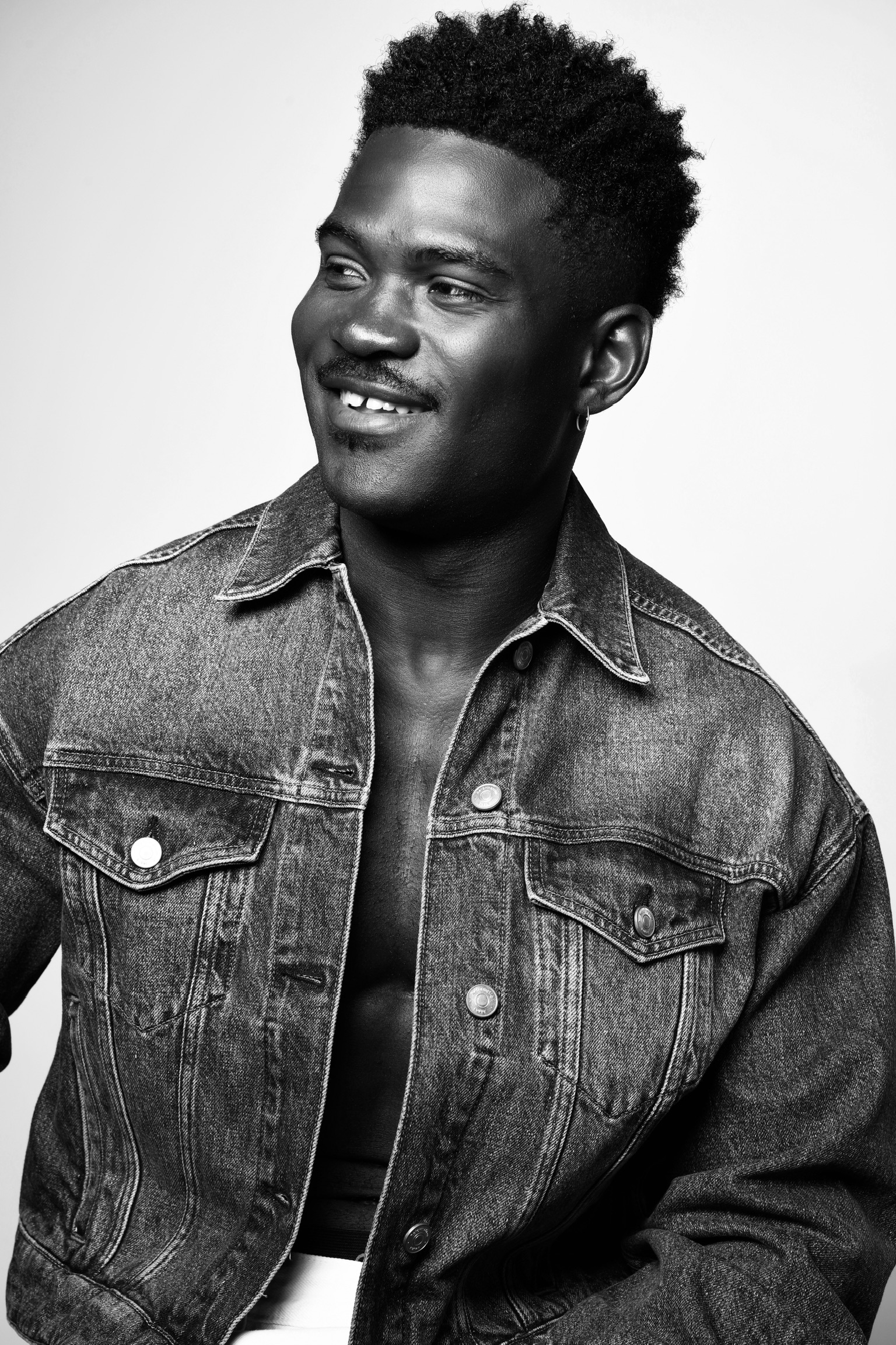 Joseph Foley — black & white denim jacket headshot
